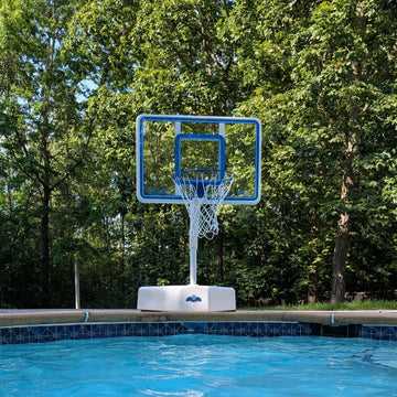 A swimming pool basketball hoop with a blue-and-white basketball in the water