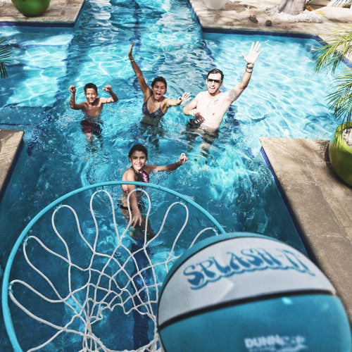 Overhead view of pool basketball with Splash-It ball mid-air and players celebrating below