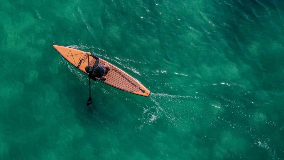 natural wood inflatable paddleboard - aerial view