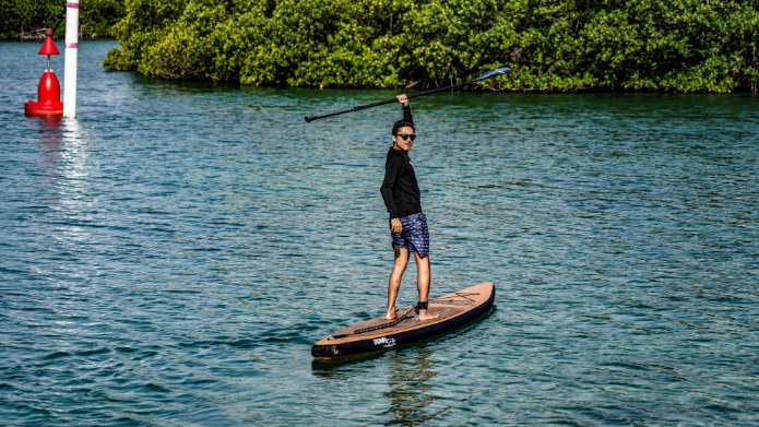 natural wood inflatable paddleboard - twisting