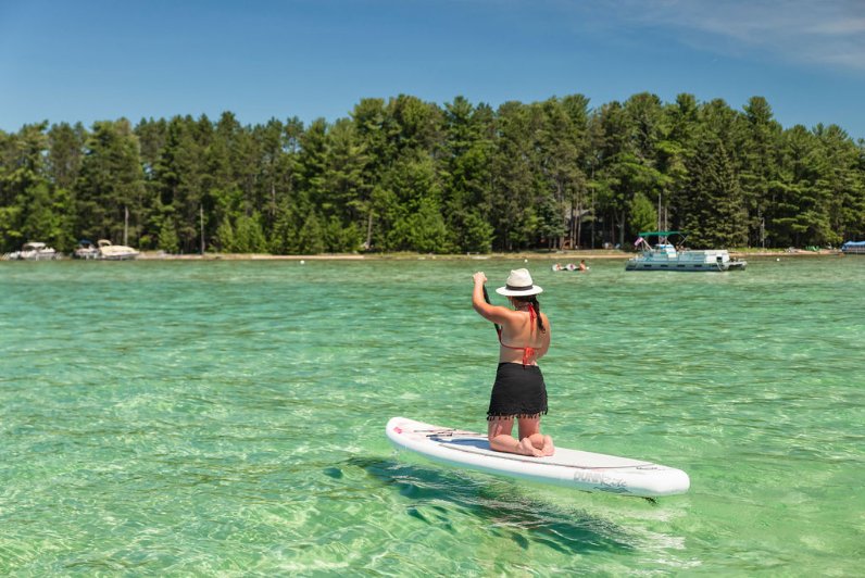 inflatable paddleboard - kneeling woman