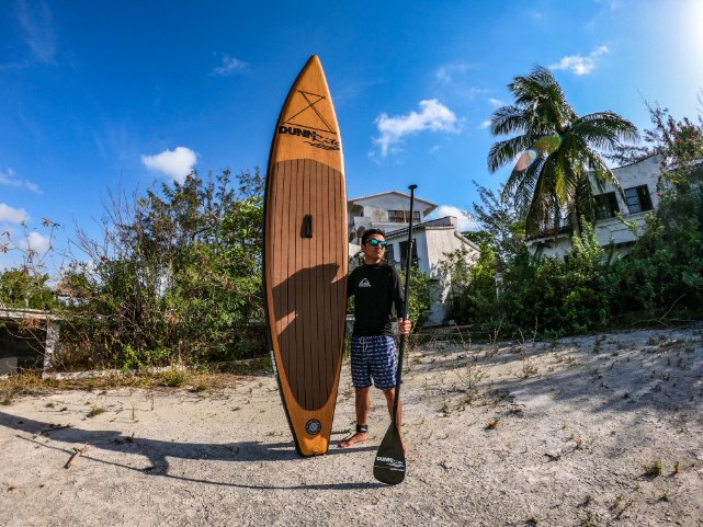natural wood inflatable paddleboard -standing with board