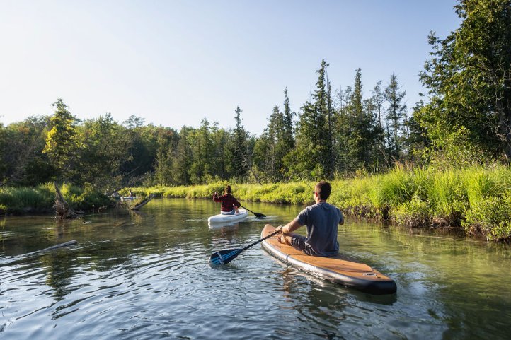 natural wood inflatable paddleboard - sitting paddling